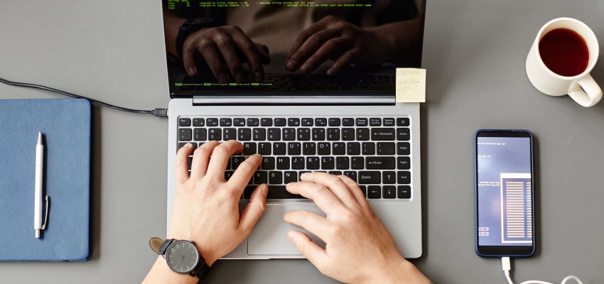developer-writing-code-top-view